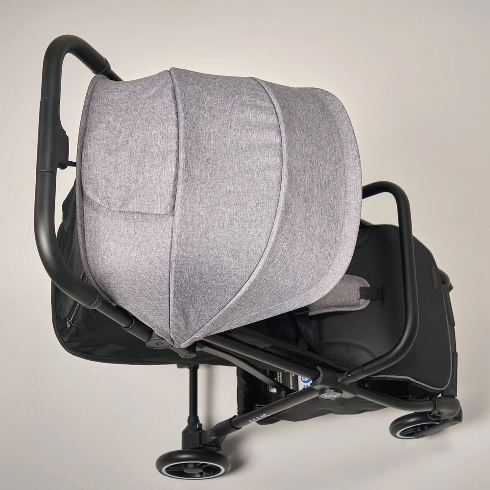 Stroller with UPF 50+ canopy protecting baby from sun