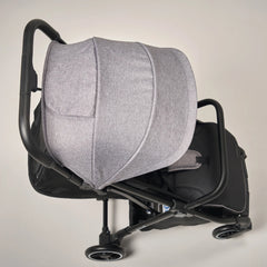 Stroller with UPF 50+ canopy protecting baby from sun