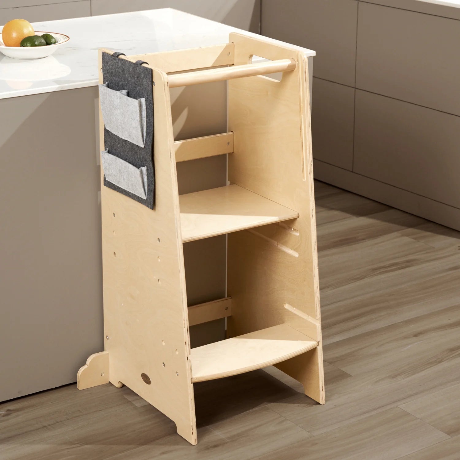 Wooden learning tower for toddlers with safety features like reinforced sides and a climb-resistant design. Includes a chalkboard.