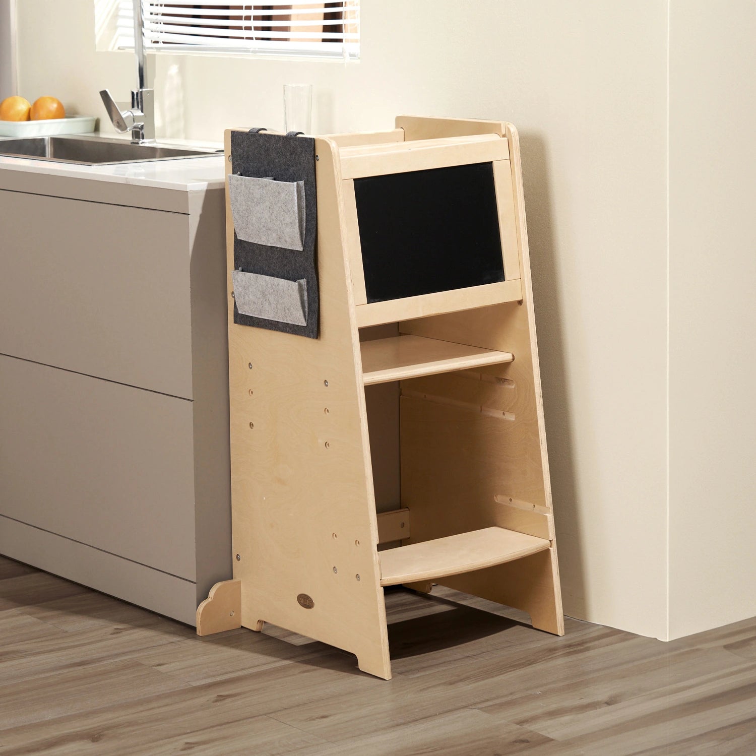 Toddler kitchen helper features an anti-climb design to enhance safety.