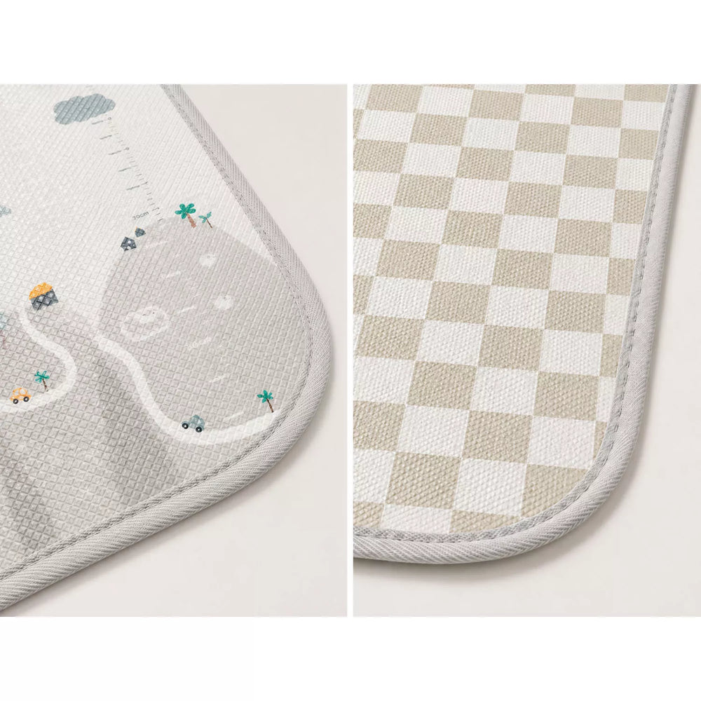 Close-up of 1cm thick durable stitched edge of XPE foam baby play mat, non-slip surface detail