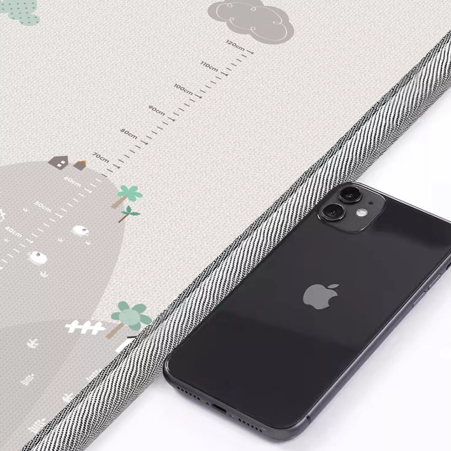 Close-up of Mountain design side with integrated height measurement chart to track baby's growth