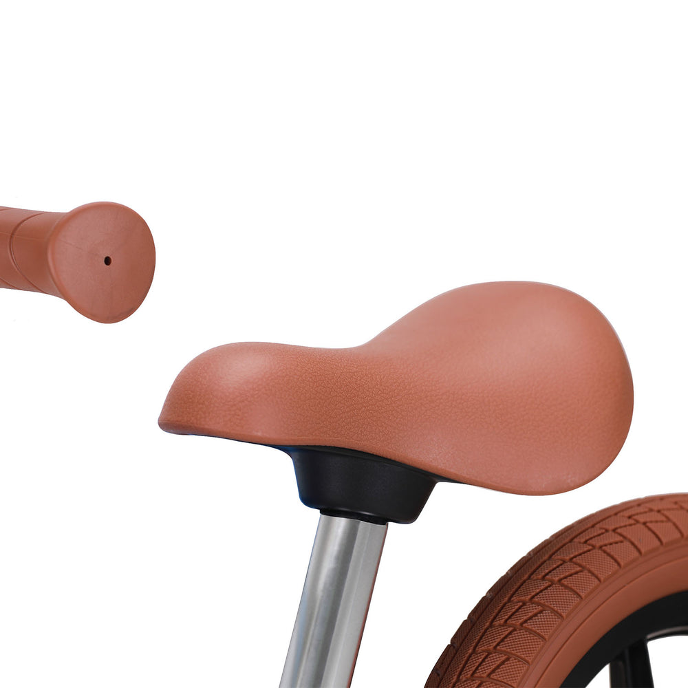 Matte black kids bike with brown accents